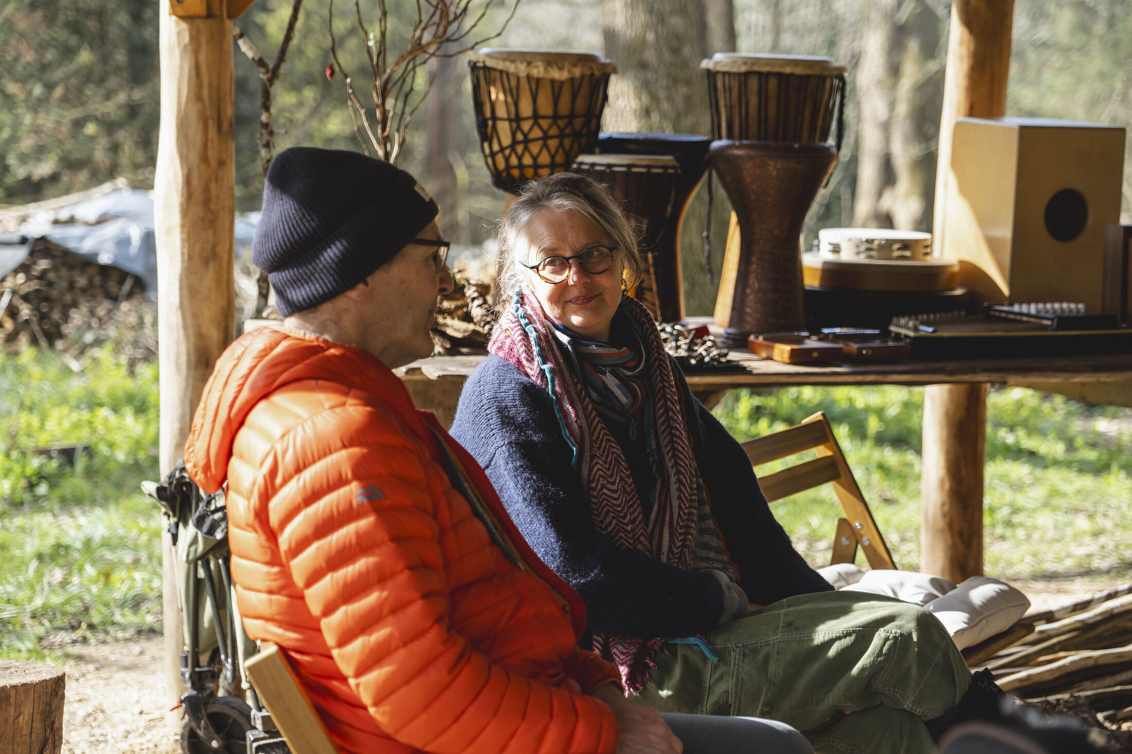Participants sharing time together at the woodland music session